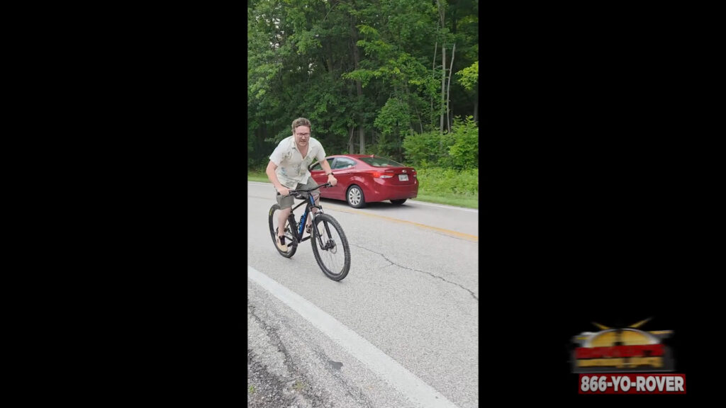 Charlie attempts bike ride up small hill